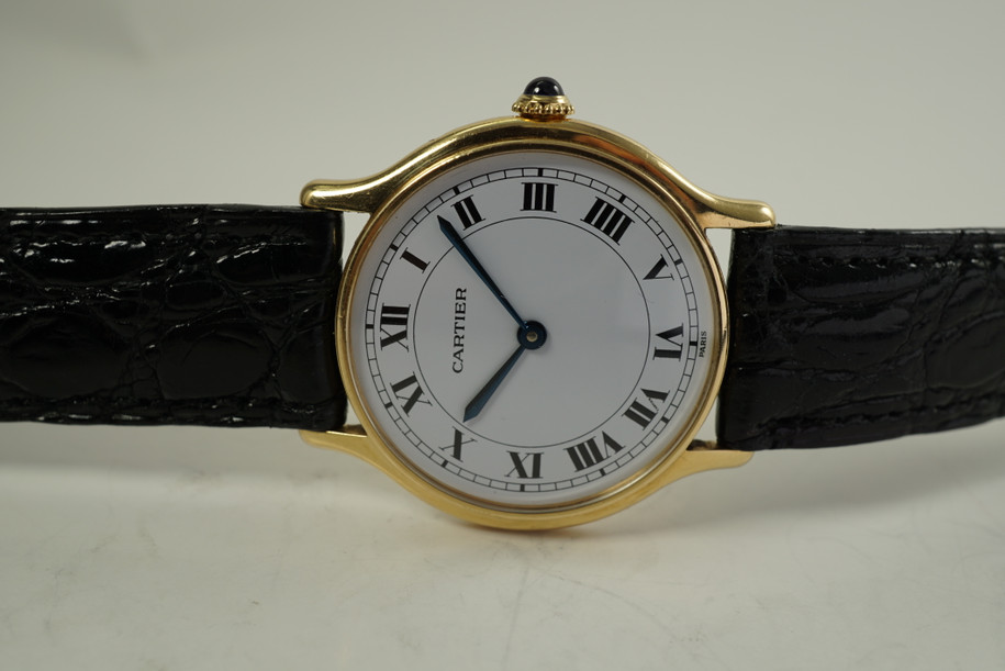 Cartier Round Paris 18k yellow gold mechanical wind dates 1990's modern pre owned for sale houston fabsuisse