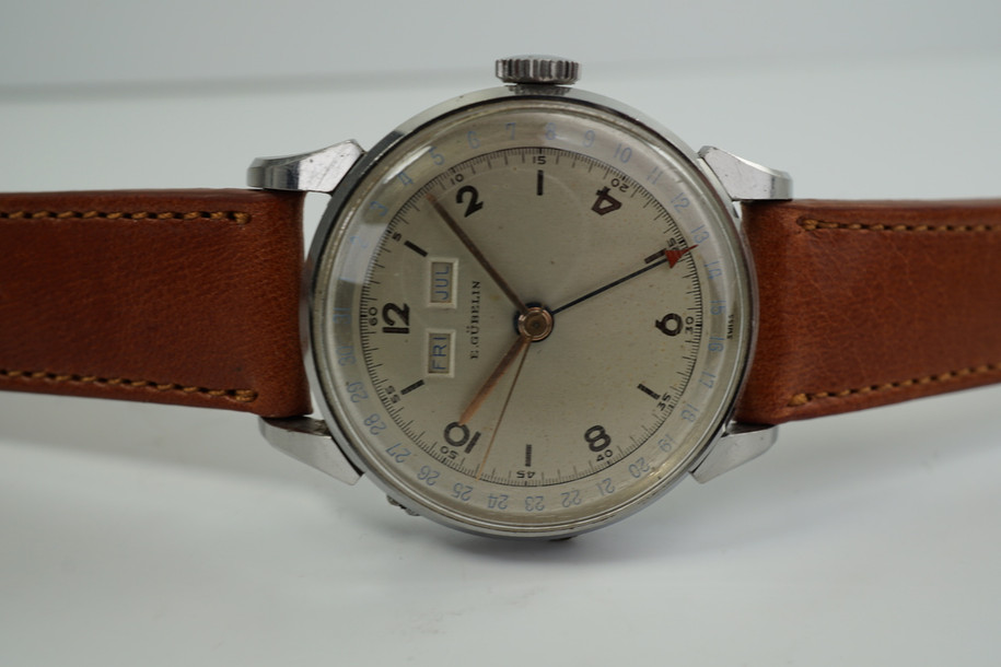 E.GUBELIN TRIPLE DATE CALENDAR WATCH. DATES FROM THE 1940'S