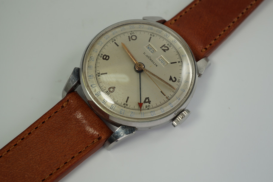 E.GUBELIN TRIPLE DATE CALENDAR WATCH. DATES FROM THE 1940'S