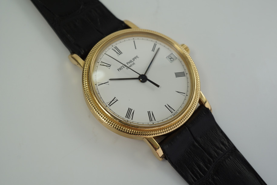 PATEK PHILIPPE 18K YELLOW GOLD CALATRAVA 3802/200 AUTOMATIC DATE CIRCA 1990'S