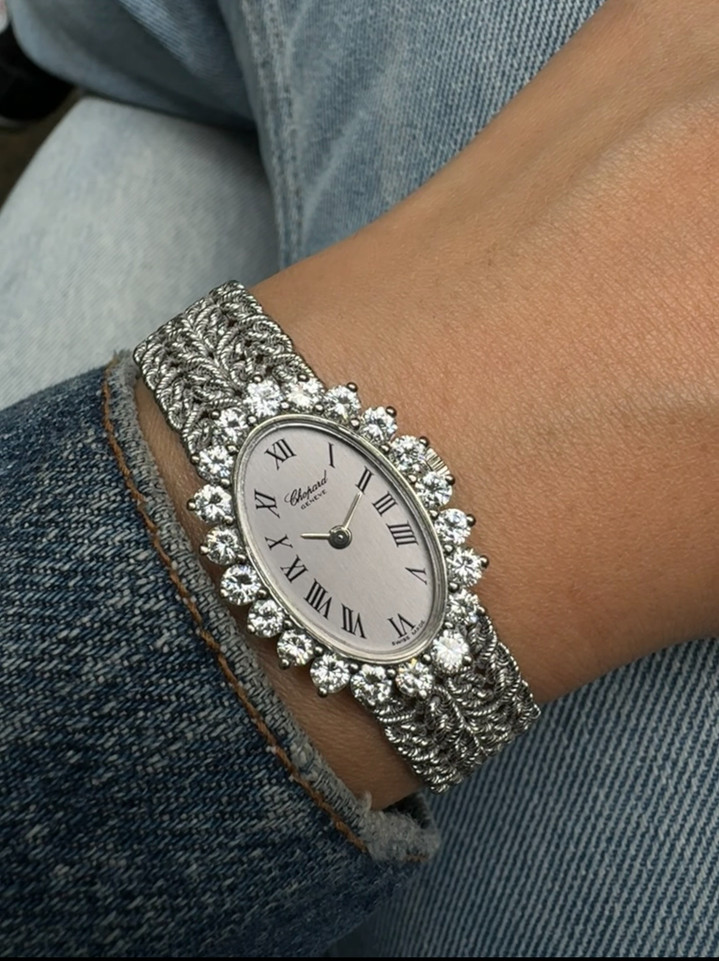 A beautiful vintage Chopard watch reference 5026-1 in 18k white gold, produced during the 1970s. Originally retailed by Birks, a Canadian leading jeweller and signed L.U.C., allocated for select high luxury pieces. The 21mm oval case is surrounded by 20 full cut diamonds bezel weighing 1.60 carats approximate, housing a silver dial, white gold applied hour hands and black Roman numerals. It wears effortlessly on the wrist for its lightness of its 6.5mm silhouette and malleability of the bracelet.

Original dial, hands and L.U.C crown.
Case measures 21 x 28.5mm, 6.5mm thick. 
20 full cut diamonds, weight 1.60+ approximate.
Sapphire crystal.
L.U.C. cal., 17 jewels mechanical winding. 
Case# 185xx 
Chopard 18k white gold bracelet length 6.5 inch or 16.5 cm.
13 mm lug width.
Modeled on 6 inch wrist.