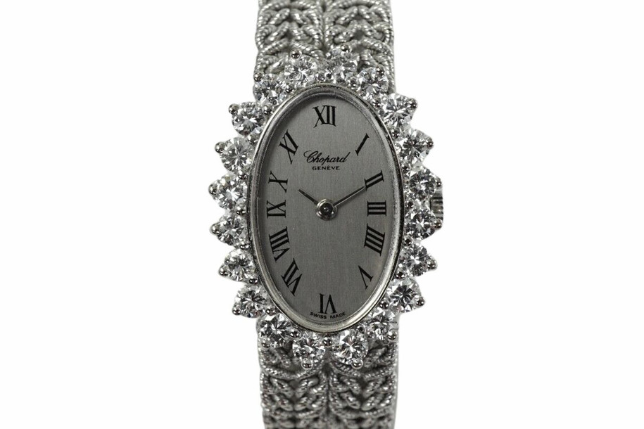 A beautiful vintage Chopard watch reference 5026-1 in 18k white gold, produced during the 1970s. Originally retailed by Birks, a Canadian leading jeweller and signed L.U.C., allocated for select high luxury pieces. The 21mm oval case is surrounded by 20 full cut diamonds bezel weighing 1.60 carats approximate, housing a silver dial, white gold applied hour hands and black Roman numerals. It wears effortlessly on the wrist for its lightness of its 6.5mm silhouette and malleability of the bracelet.

Original dial, hands and L.U.C crown.
Case measures 21 x 28.5mm, 6.5mm thick. 
20 full cut diamonds, weight 1.60+ approximate.
Sapphire crystal.
L.U.C. cal., 17 jewels mechanical winding. 
Case# 185xx 
Chopard 18k white gold bracelet length 6.5 inch or 16.5 cm.
13 mm lug width.
Modeled on 6 inch wrist.