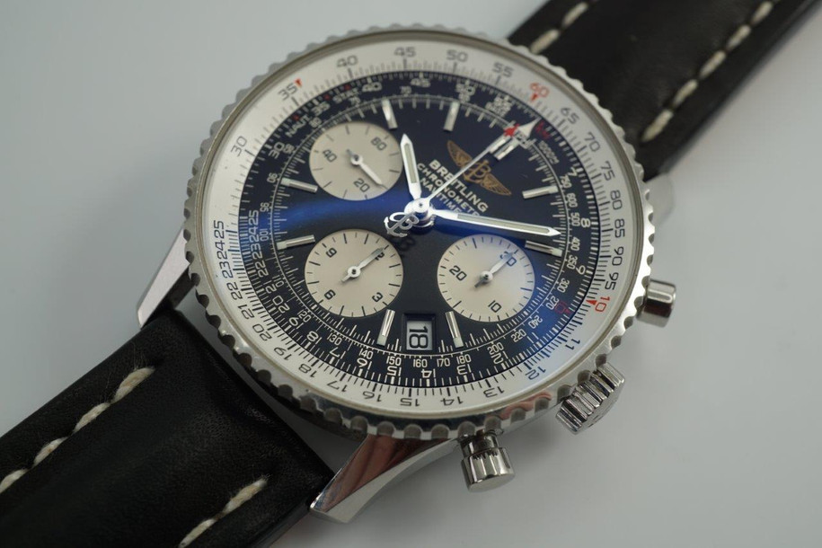 BRAND:                            Breitling 
MODEL:                            Navitimer  
CASE MATERIAL:            Stainless steel
CASE MEASURES:          41 x 48 mm
MOVEMENT:                     Automatic
FUNCTIONS:                    Chronograph and date 
CONDITION:                     Excellent
See it in our eBay store.
A modern preowned Breitling Navitimer in stainless steel, crafted circa 2010. Commands a bold presence on the wearer’s wrist, with its large 41 mm case and black and white chronograph dial, the blue antireflective film catching the light at times. Modeled on size 6 inch wrist. 

Breitling books, certificates and slide rule.
Original dial, hands and crown.
Case measures 41 x 48 mm, 9mm thick.
Breitling cal. 7753-24 automatic winding.
Serial# 2242xxx
Sapphire crystal.
Breitling black leather strap (% condition)with deployment buckle .
Breitling black leather strap with buckle, unworn.
22 mm lug width.