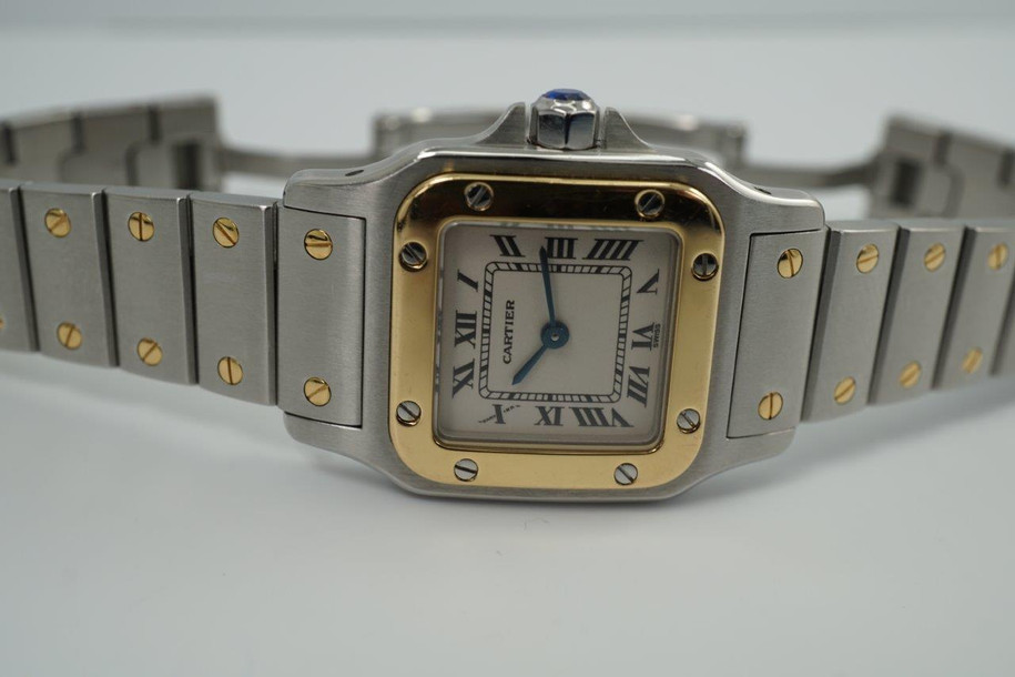 BRAND:                            Cartier 
MODEL:                            Santos Galbee
CASE MATERIAL:            Stainless steel/18k yellow gold
CASE MEASURES:          24 x 35 mm
MOVEMENT:                     Quartz
FUNCTIONS:                    Time
CONDITION:                     Fine
See it in our eBay store.
A classic Cartier Santos Galbee 1567 in stainless steel and 18k yellow gold, produced in the 1990s. Easy to wear for a sporty and casual look, elevated by its gold bezel and signature screws. Comfort fit with the double folding clasp mechanism and thin profile. Modeled on size 6 inch wrist. 

Light scratches.
Original dial, hands and crown. 
Case measures 24 x 35, 6mm thick.
Cartier quartz movement. 
Serial# 3807xxCD
Sapphire crystal.
Cartier bracelet fits 6 inches approximate.
14 mm between lugs.