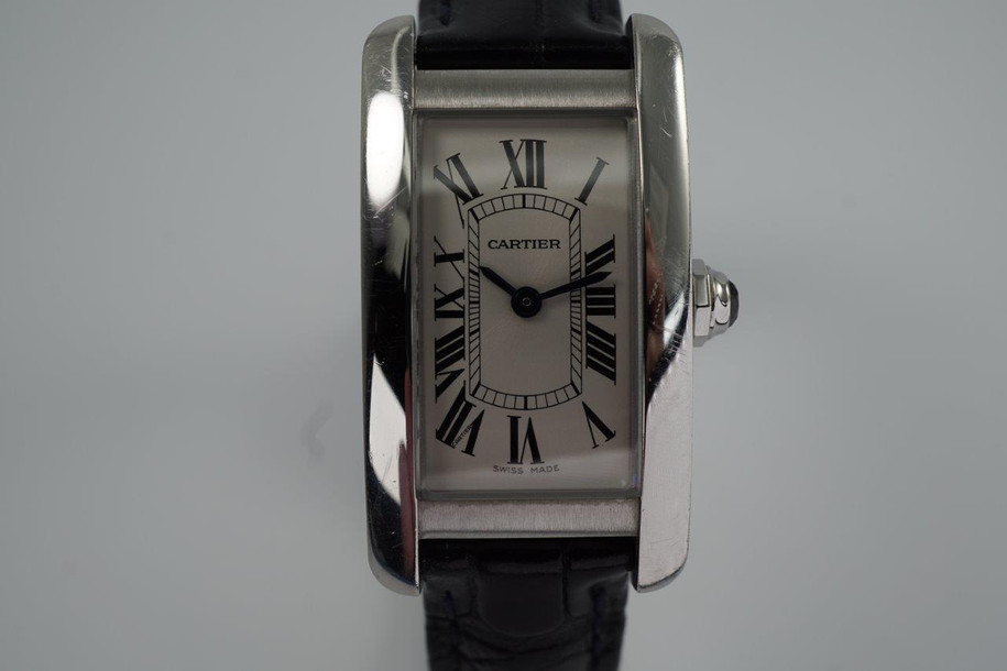 BRAND:                           Cartier
MODEL:                           Tank Americaine
CASE MATERIAL:            Stainless steel 
CASE MEASURES:          19 x 35 mm
MOVEMENT:                     Quartz
FUNCTIONS:                    Time
CONDITION:                     Very good
See it in our eBay store.
A fine preowned Cartier Tank Americaine reference 3970 in stainless steel, crafted circa 2020.  Classic minimal style with the white dial in stainless steel case and black leather strap that would suit a variety of occasions. Modeled on a 6 inch wrist. 

Light scratches and scuffs.
Case measures 19 x 35, 7 mm thick. 
Cartier caliber quartz movement.
Serial# 1049xxxX
Carter black alligator strap (85% condition).
Cartier steel deployment buckle.
13 mm between lugs.