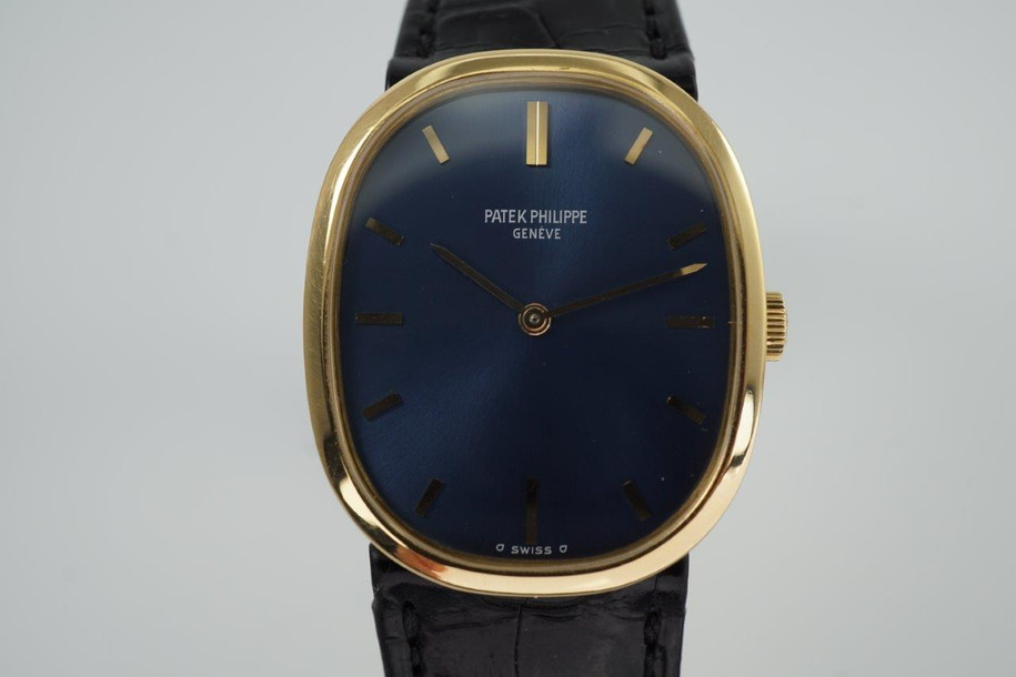 BRAND:                           Patek Philippe
MODEL:                           Ellipse
CASE MATERIAL:            18k yellow gold
CASE MEASURES:          27 x 32 mm
MOVEMENT:                   Mechanical
FUNCTIONS:                   Time 
CONDITION:                    Fine
See it in our eBay store.

A fine vintage Patek Phillipe 3548 Ellipse in 18k yellow gold, crafted during the 1970s. Its charm lies in the oval shape seen in the case, the theme extending to the buckle and strap end. Features a beautiful sunburst blue Patek sigma dial with gold hands, and paired with a black crocodile strap. Ideal for a variety of settings and outfits. Modeled on 6 inch wrist. 

Light scratches. 
Original blue and gold Patek sigma dial, hands and crown.
Case measures 27 x 32 mm, 6 mm thick.
Patek cal. 23-300, 18 jewels mechanical winding.
2 seals of Geneva. 
Sapphire crystal. 
Case# 2717xxx Movement# 12143xx
Patek black crocodile strap (75% condition approximate).
Patek 18k gold buckle. 
19mm between lugs.