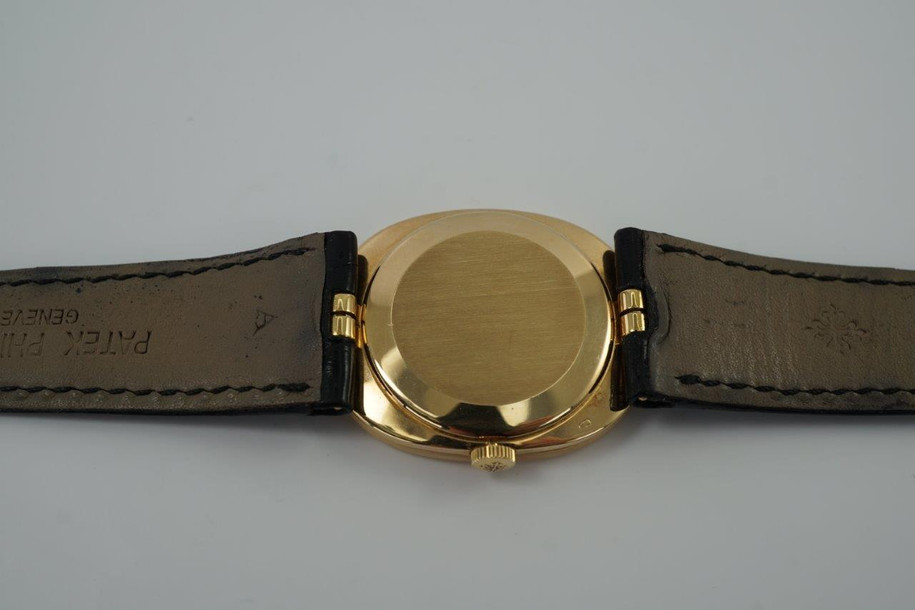 BRAND:                           Patek Philippe
MODEL:                           Ellipse
CASE MATERIAL:            18k yellow gold
CASE MEASURES:          27 x 32 mm
MOVEMENT:                   Mechanical
FUNCTIONS:                   Time 
CONDITION:                    Fine
See it in our eBay store.

A fine vintage Patek Phillipe 3548 Ellipse in 18k yellow gold, crafted during the 1970s. Its charm lies in the oval shape seen in the case, the theme extending to the buckle and strap end. Features a beautiful sunburst blue Patek sigma dial with gold hands, and paired with a black crocodile strap. Ideal for a variety of settings and outfits. Modeled on 6 inch wrist. 

Light scratches. 
Original blue and gold Patek sigma dial, hands and crown.
Case measures 27 x 32 mm, 6 mm thick.
Patek cal. 23-300, 18 jewels mechanical winding.
2 seals of Geneva. 
Sapphire crystal. 
Case# 2717xxx Movement# 12143xx
Patek black crocodile strap (75% condition approximate).
Patek 18k gold buckle. 
19mm between lugs.