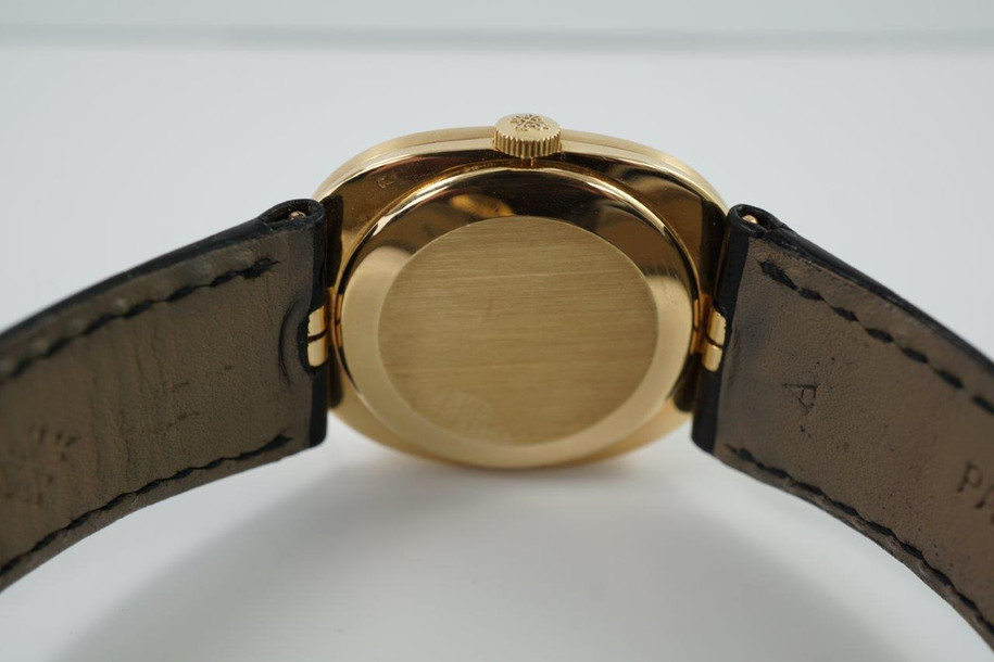 BRAND:                           Patek Philippe
MODEL:                           Ellipse
CASE MATERIAL:            18k yellow gold
CASE MEASURES:          27 x 32 mm
MOVEMENT:                   Mechanical
FUNCTIONS:                   Time 
CONDITION:                    Fine
See it in our eBay store.

A fine vintage Patek Phillipe 3548 Ellipse in 18k yellow gold, crafted during the 1970s. Its charm lies in the oval shape seen in the case, the theme extending to the buckle and strap end. Features a beautiful sunburst blue Patek sigma dial with gold hands, and paired with a black crocodile strap. Ideal for a variety of settings and outfits. Modeled on 6 inch wrist. 

Light scratches. 
Original blue and gold Patek sigma dial, hands and crown.
Case measures 27 x 32 mm, 6 mm thick.
Patek cal. 23-300, 18 jewels mechanical winding.
2 seals of Geneva. 
Sapphire crystal. 
Case# 2717xxx Movement# 12143xx
Patek black crocodile strap (75% condition approximate).
Patek 18k gold buckle. 
19mm between lugs.