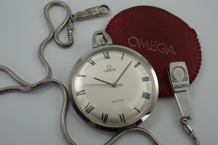 BRAND:                           Omega
MODEL:                           DeVille
CASE MATERIAL:           Stainless steel
CASE MEASURES:          44 mm
MOVEMENT:                   Mechanical
FUNCTIONS:                   Time 
CONDITION:                    Fine
See it in our eBay store.

A fine Omega DeVille pocket watch reference 131-1746 in stainless steel, crafted circa 1972. This wonderful accessory fits delightfully in the hand and has a nice light weight feel to it, and is in mint condition. Accompanies a red leather sleeve stamped OMEGA and a snake chain with Omega logo clip, unusual to find one complete. It has not been serviced, it runs and functions as normal.

Light scratches. 
Original dial, hands and crown.
Case measures 44 mm, 9 mm thick.
Omega cal. 1035 mechanical wind.
Sweep second
Case maker ADB ref. 131-1746
Serial# 358006xx
Acrylic crystal. 
Red leather pouch and fob.