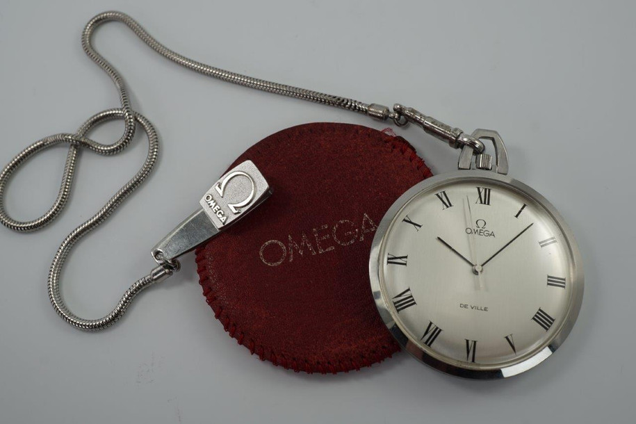 BRAND:                           Omega
MODEL:                           DeVille
CASE MATERIAL:           Stainless steel
CASE MEASURES:          44 mm
MOVEMENT:                   Mechanical
FUNCTIONS:                   Time 
CONDITION:                    Fine
See it in our eBay store.

A fine Omega DeVille pocket watch reference 131-1746 in stainless steel, crafted circa 1972. This wonderful accessory fits delightfully in the hand and has a nice light weight feel to it, and is in mint condition. Accompanies a red leather sleeve stamped OMEGA and a snake chain with Omega logo clip, unusual to find one complete. It has not been serviced, it runs and functions as normal.

Light scratches. 
Original dial, hands and crown.
Case measures 44 mm, 9 mm thick.
Omega cal. 1035 mechanical wind.
Sweep second
Case maker ADB ref. 131-1746
Serial# 358006xx
Acrylic crystal. 
Red leather pouch and fob.