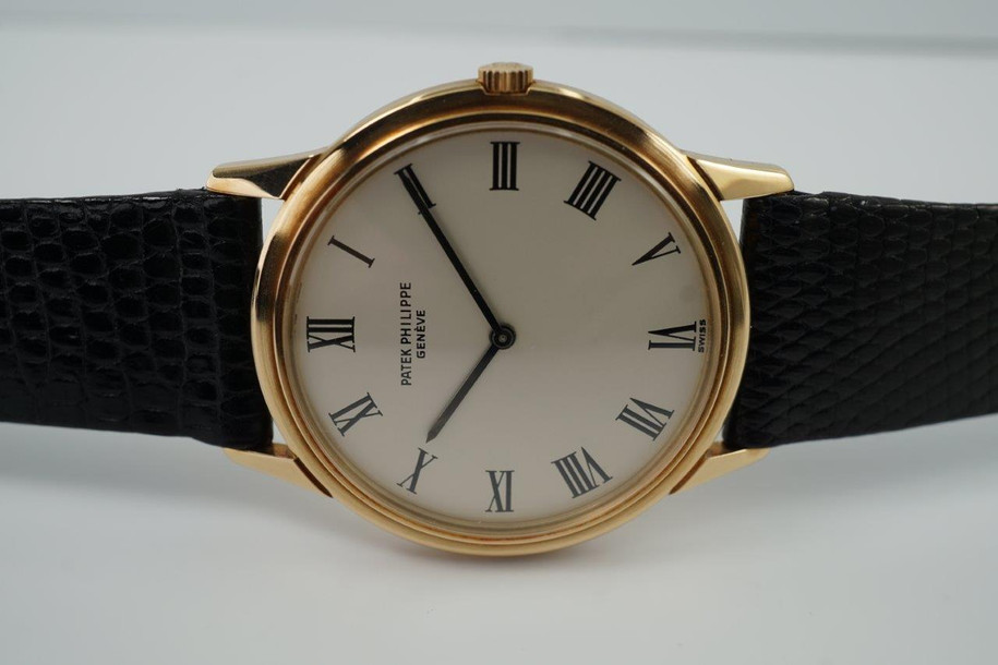 BRAND:                          Patek Philippe
MODEL:                          Calatrava
CASE MATERIAL:           18k yellow gold
CASE MEASURES:          33 x 39 mm
MOVEMENT:                   Automatic
FUNCTIONS:                   Time
CONDITION:                    Fine
See it in our eBay store.

A fine vintage Patek Philippe Calatrava reference 3591, crafted during the 1970s. A classic from Patek’s popular model featuring a thin profile housing an automatic movement, silver-tone dial with black marker hands and Roman numerals, and subtle stepped bezel. Suitable for all occasions. Modeled on 6 inch wrist.

Toning on case.
Original dial, hands and crown. 
Case measures 33 x 39 mm, 6.5 thick.
Patek cal., 28-255, 36 jewels automatic. 
2 seals of Geneva.
Movement# 12813xx Case# 5220xx
Sapphire crystal.
Patek black lizard strap (80% condition approximate).
Patek gold buckle. 
18mm between lugs.