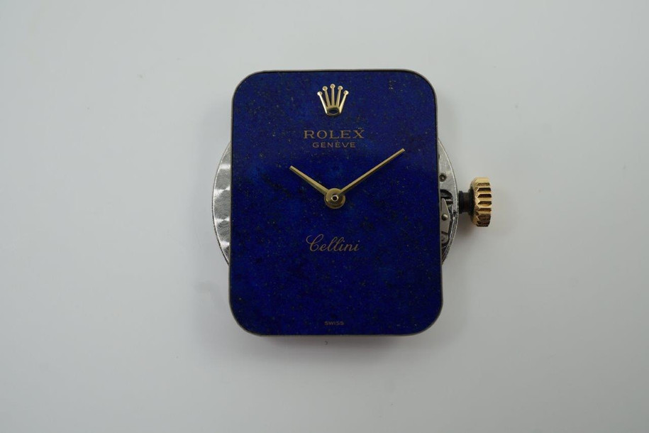 A fine vintage Rolex bracelet watch reference 4628 in 18k yellow gold, crafted circa 1985. A beautiful accessory featuring a gorgeous lapis dial with hints of pyrite peeking through radiates vividly in the light, and flanked by diamonds meticulously set on white gold seamlessly transfiguring into the yellow gold. Its 5.5mm rectangular profile provides an overall lightweight feel and the bracelet drapes the wrist comfortably. Suitable for all dress occasions. Modeled on 6 inch wrist.

Light scratches.
Original factory lapis dial, hands and crown.
Factory diamond set.
Case measures 23 x 25 mm, 5.5 mm thick. 
Rolex cal. 1601, 19 jewels mechanical winding.
Serial# 8833xxx Case# 793877
Sapphire crystal. 
Rolex bracelet fits 6 3/4 inches or 17.5cm, approximately.
15mm taper.
Weight 57.8 grams.