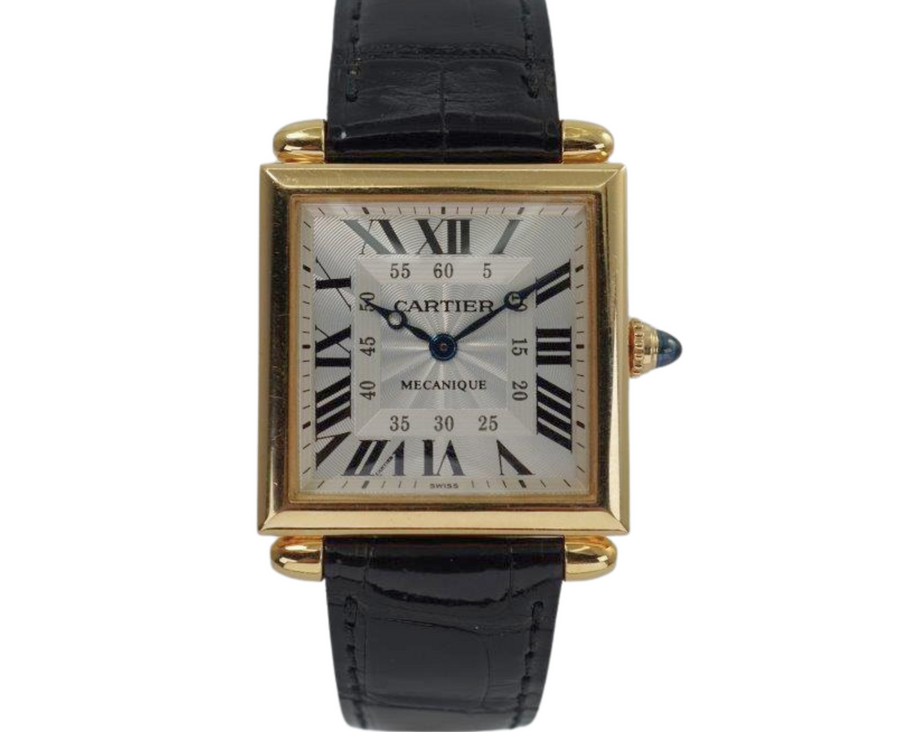 A fine preowned Cartier Tank Obus 2380 in 18k yellow gold, crafted circa 1998. The Obus is an iteration of the century-old Tank from Cartier, the name deriving from the French word “bullet” referencing the bullet-shaped lugs. The case sits prominently on the wrist without overwhelming the wearer, encompassing the silver guilloche dial, blued breguet hands black Roman numerals and blue sapphire cabochon crown. From the Collection Privée Cartier Paris line, the exhibition case back reveals the Cartier movement with special attention to interlocking C logo design making this an excellent piece for the collector’s repertoire. Modeled on 6 inch wrist.

Light tarnish.
Includes CPCP inner and outer box, and papers.
Original guilloche dial, blued breguet hands and Cartier crown. 
Case measures 26.5 x 33.5 mm, 8 mm thick. 
Cartier cal. 1585MC, 18 jewel mechanical.
Serial# CC451xxx Movement# 0843
Sapphire crystal. 
Cartier black crocodile strap (85% condition).
Cartier 18k yellow gold buckle. 
17 mm lug width.