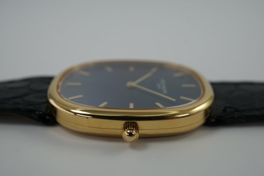 A fine preowned Patek Philippe Golden Ellipse in 18k yellow gold, crafted during the 2000s. A popular model from Patek for its perfectly proportionately oval case encasing a blue sunburst dial that glistens in the light beautifully with the shiny gold hour markers and hands. Paired with a black alligator strap for a casual and comfortable feel, with buckle that replicates the oval motif. 

Minimal scratches. 
Original blue sunburst dial, gold markers/hands and Patek crown. 
Case measures 31 x 36 mm, 6mm thick. 
Patek cal. 240, automatic winding.
Sapphire crystal. 
Patek Philippe black alligator strap (80% condition). 
Patek Ellipse 18k buckle 
20mm lug width. 
Modeled on 6 inch wrist.