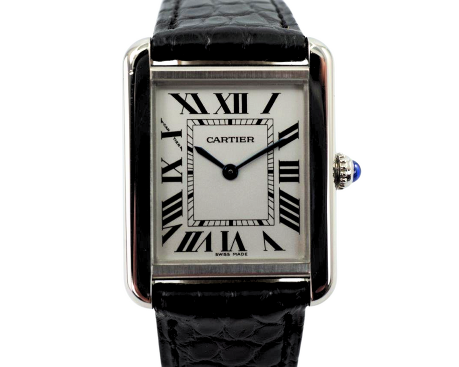 A fine preowned Cartier Tank Solo reference 2716 in stainless steel, crafted circa 2015. A casual everyday accessory, with the 6mm profile case encasing a white Roman dial, black Roman numeral hours with hidden Cartier hallmark at 10 o’clock, and blued steel hands. Paired with a black crocodile strap and blue sapphire cabochon crown, this classic configuration of the popular Tank will serve a variety of occasions. 

Minimal scratches. 
Original dial, hands and crown
Case measures 24 x 31 mm, 6mm thick. 
Cartier quartz movement. 
Sapphire crystal. 
Cartier adjustable black crocodile strap (90% condition), fits 6 3/4 inches.
Cartier steel deployment. 
17mm lug width. 
Modeled on 6 inch wrist.