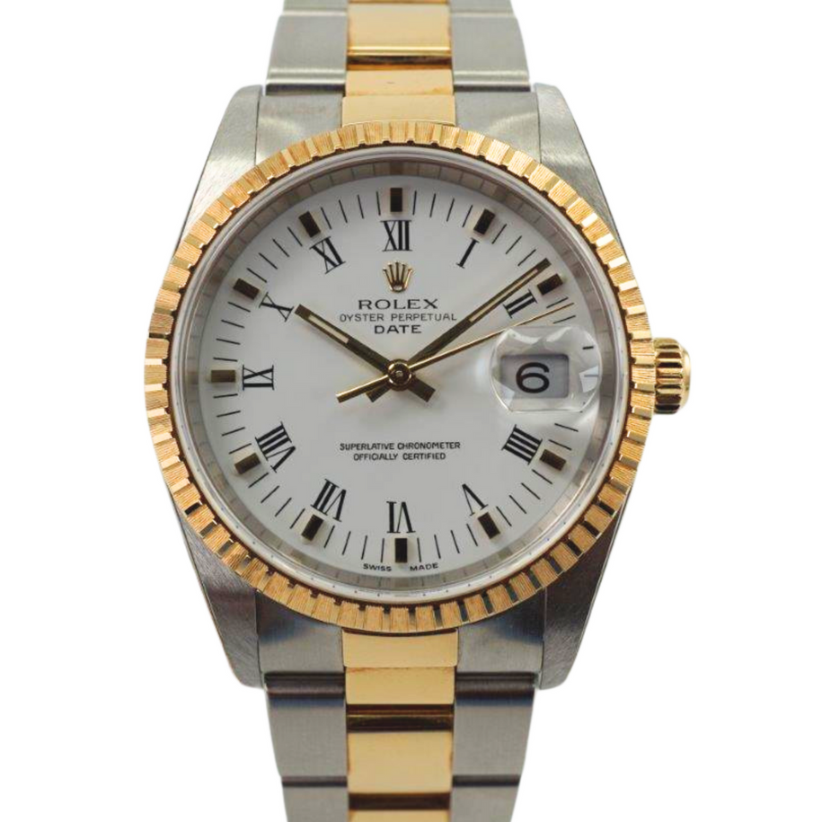 A fine new old stock Rolex Date reference 15223 in 18k yellow gold and stainless steel, crafted circa 2005. In unpolished condition, as if it left the Rolex boutique with tags attached and very little wear, if any, shown and still adhered original Rolex stickers. Featuring a 34.5 mm two-tone case housing a white dial with gold applied hour markers and hands, black numeral hours and minute markers, with date aperture, engine turned gold bezel and a two-tone oyster bracelet with adjustable fold clasp. A popular and enduring model to wear for various occasions.