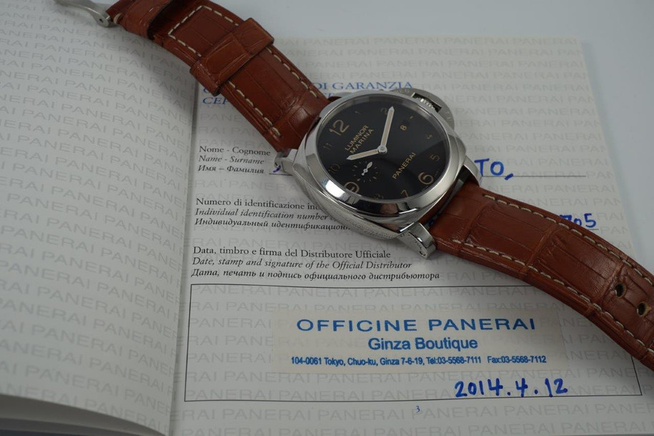 A fine preowned Panerai Luminor Marina 1950 reference PAM 00359 with wooden box and books originally sold from Ginza Boutique Japan, crafted circa 2014. A bold piece fitting for a large wrist, features a sandwich black dial with large lume Arabic numeral hours and sword-shaped hands, subsidiary dial and date aperture, surrounded by a 45 mm steel case with elevated 18 mm silhouette and exhibition case back. Self-winding for 3 days. Suitable for casual wear.