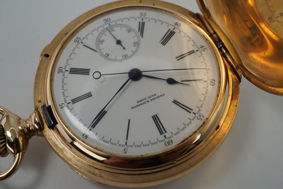 A very nice antique Patek Philippe Chronograph for Jacques & Marcus New York, in 18k yellow gold crafted circa 1885-1890. Case is signed Jacques & Marcus N.Y. serial number 80395, the same number matches the Patek signed movement number. White enamel dial with black Roman numeral hour markers and outer minute track, blued-steel spade-like hands, and subsidiary seconds. Hinges are tight, this substantially weighted watch has been well cared for, making it a beautiful collector's piece.


Original dial and hands.
Watch weighs 129.5 grams.
Case measures 50 mm, 15 mm thick.
Mineral glass crystal.
Patek Philippe Geneva nickeled highly jeweled stem wind movement. 
Movement runs strong and functions properly. We do not know of its service history.
