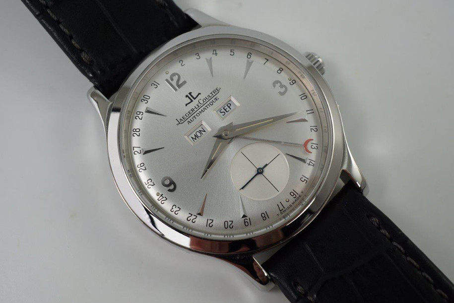 A fine preowned Jaeger LeCoultre Master Control reference 140.8.87 in stainless steel, dated in 1999. The 37 mm smooth bezel case and tapered lugs and JLC signed notched crown contains a silvered dial, dauphine and Arabic hour markers, silver tapered hands with lume, day and date aperture, outer month indicator pointed by a red crescent moon, and subsidiary seconds dial. Paired with a black leather strap and original single deployant buckle, the handsome accessory is suitable for various occasions.