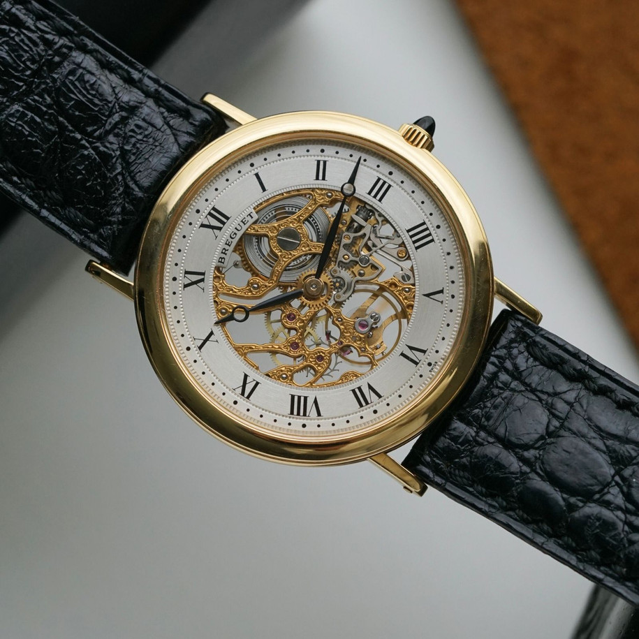 Fabsuisse watch
Fabsuisse vintage
Breguet classique
Breguet skeleton
Breguet sleletonized
Breguet 3020BA
Breguet rare watch
Skeleton watch 18k
Breguet vintage
Breguet vintage 18k
Breguet vintage gold
Breguet gold skeleton
Breguet skeleton vintage
Breguet skeletonized watch
Original dial, hands and crown.
Case measures 33.4 x 38mm, 5mm thick.
Breguet cal. 503SQ manual wind, 18 jewels gold skeletonized hand engraved movement. 
Case# 36xx
Exhibition case back. 
Sapphire crystal.
Breguet black textured leather strap (90% condition, approximation).
Fits up to 7 1/8 inches.
Breguet 18k tang buckle.
19mm lug width.
Modeled on 6 inch wrist.