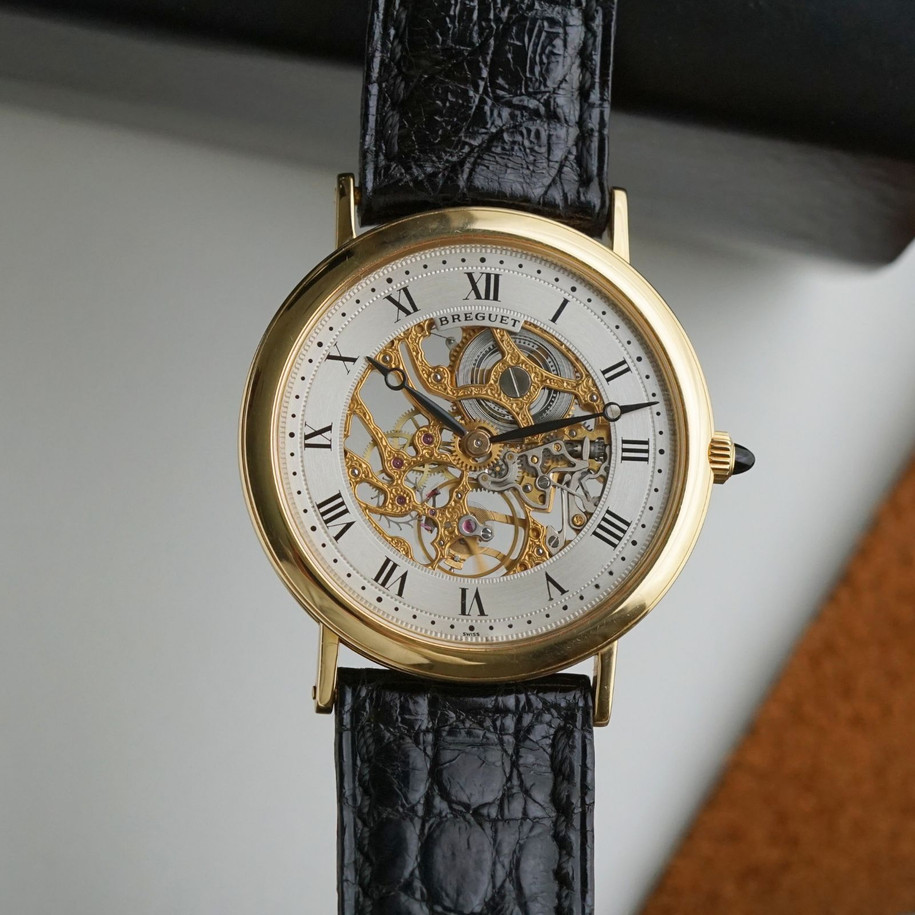 Fabsuisse watch
Fabsuisse vintage
Breguet classique
Breguet skeleton
Breguet sleletonized
Breguet 3020BA
Breguet rare watch
Skeleton watch 18k
Breguet vintage
Breguet vintage 18k
Breguet vintage gold
Breguet gold skeleton
Breguet skeleton vintage
Breguet skeletonized watch
Original dial, hands and crown.
Case measures 33.4 x 38mm, 5mm thick.
Breguet cal. 503SQ manual wind, 18 jewels gold skeletonized hand engraved movement. 
Case# 36xx
Exhibition case back. 
Sapphire crystal.
Breguet black textured leather strap (90% condition, approximation).
Fits up to 7 1/8 inches.
Breguet 18k tang buckle.
19mm lug width.
Modeled on 6 inch wrist.
