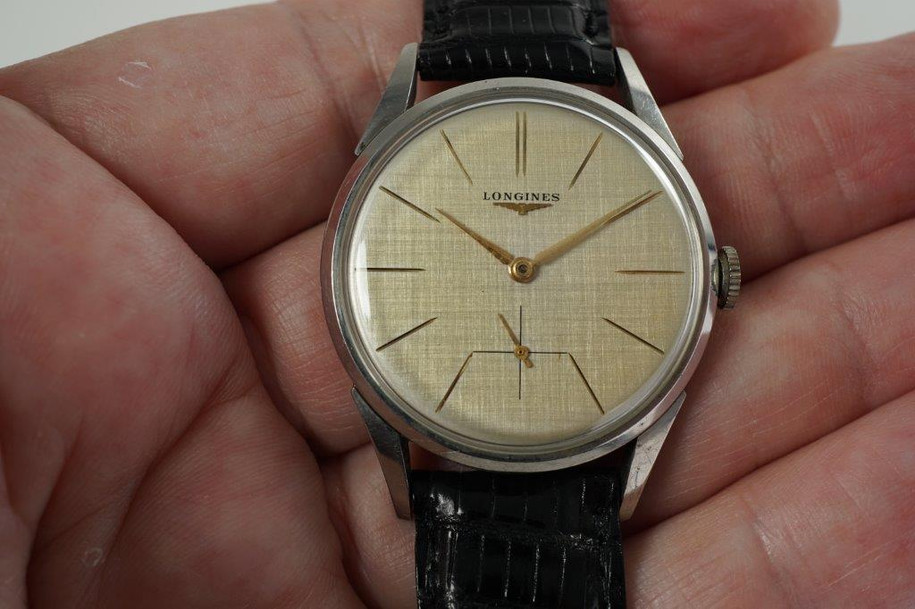 Longines 7111-2 large stainless steel linen dial wristwatch dates 1959 pre owned for sale houston fabsuisse