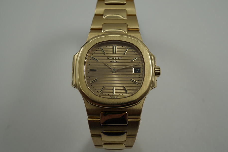 atek Philippe 4700 Nautilus ladies 18k yellow gold dates 1990's pre owned for sale houston fabsuisse