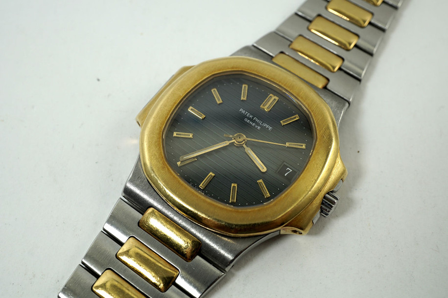 Patek Philippe 3800/1 Nautilus steel & 18k yellow gold orginal with date automatic dates 1990's for sale houston fabsuisse