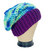 Profile view: Handcrafted Hippie Boho Crochet Slouchy Hat, meticulously crafted from ultra-soft yarn in vibrant shades of blues, greens, and purples! Embrace versatility with a design that effortlessly complements various hair lengths and styles, from short sassy cuts to cascading locks or even short to medium dreadlocks. Perfect for expressing your unique individuality, this hat is a must-have accessory for those embracing the Hippie or Skater vibe.