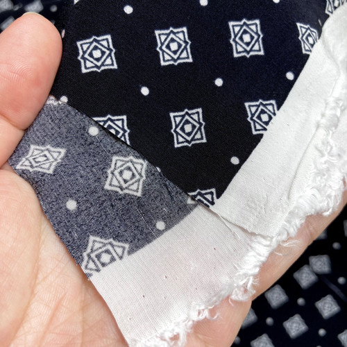140gsm blue-black motif half crepe, by metre