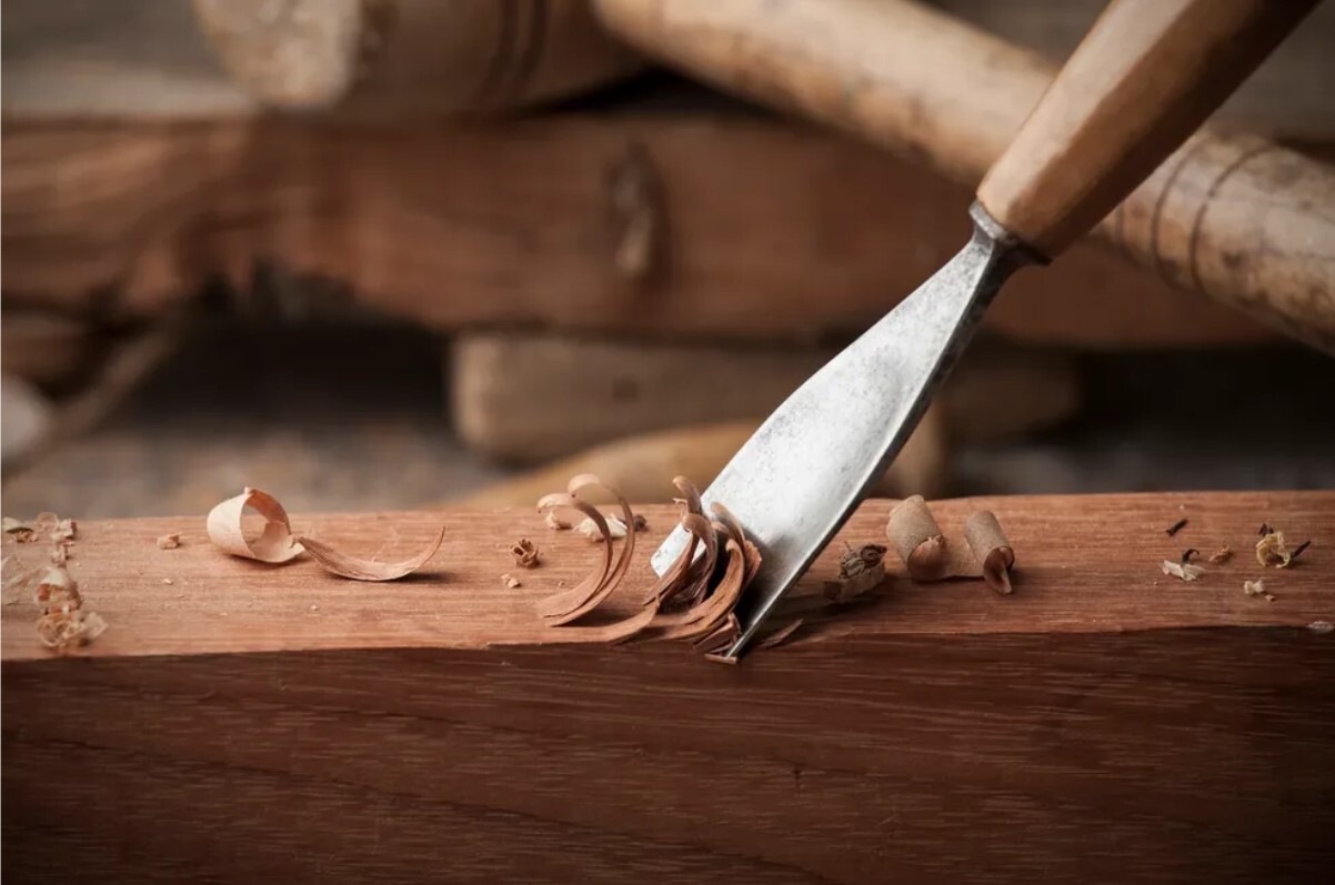 Skilled Honduran artisan crafting mahogany furniture