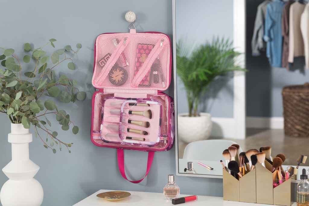 Pink makeup case hanging on a wall