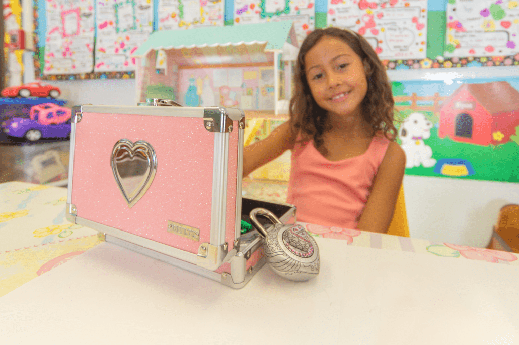 Girl with a pink pencil box