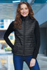 Port Authority® Women's Packable Puffy Vest close up on model