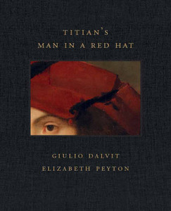 Detail of Titian's Man in a Red Hat painting framed by dark grey cloth. The title of the book in gold font: Titian's Man in a Red Hat on top the image and the names of the authors in gold font: Giulio Dalvit and Elizabeth Peyton.