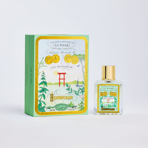 Fragrance box and bottle called Heliotrope Blanc featuring a mint green label.