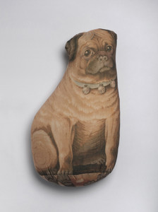 Pillow shaped as a pug.