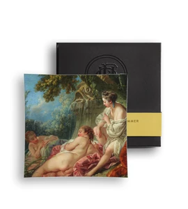 Glass plate featuring three semi-nude female figures reclining in a garden.
