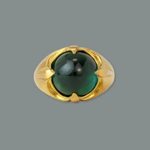 gold ring with green stone.