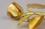 Back detail of rose petals and leaves from gold rose brooch.
