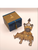 Puzzle box and rhino puzzle assembled and displayed beside the box.