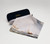 Open eyeglass case with the dust cloth draped over which features Turner's painting: Antwerp: Van Goyen Looking Out for a Subject.