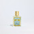 Fragrance bottle called Reine des Fleurs featuring a blue label.
