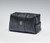 Black leather bag for cosmetics, sport accessories, and everyday essentials. The bag features the Frick's monogram "HCF" stamped in silver at the center and a gunmetal statement zipper.  Angled shot.