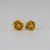 gold earrings which look like roses.