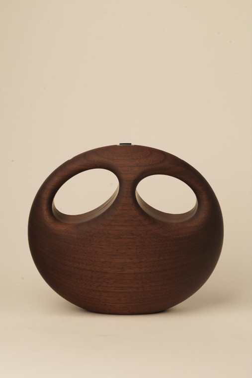 Dark walnut wood handbag with two oval openings forming an owl-like face, photographed closed against a neutral background.