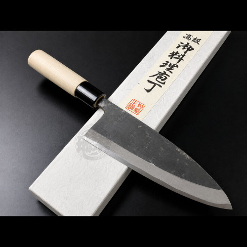 Authentic Tsukiji Aritsugu black Deba knife with a rustic black-forged finish for heavy-duty butchery.