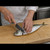 Professional chef filleting a fish with an Aritsugu Black Deba knife 150mm White Steel #3