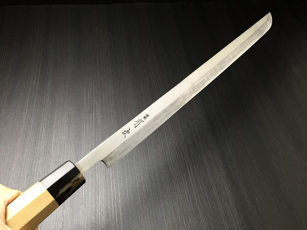 Close-up of the authentic Tsukiji Aritsugu brand engraving on a premium White Steel blade.