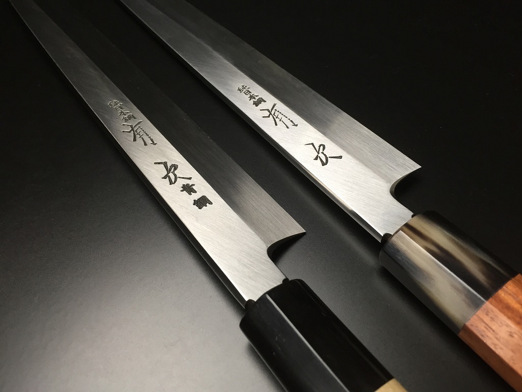Comparison of authentic Aritsugu Honyaki Yanagiba knives: White Steel versus Blue Steel.